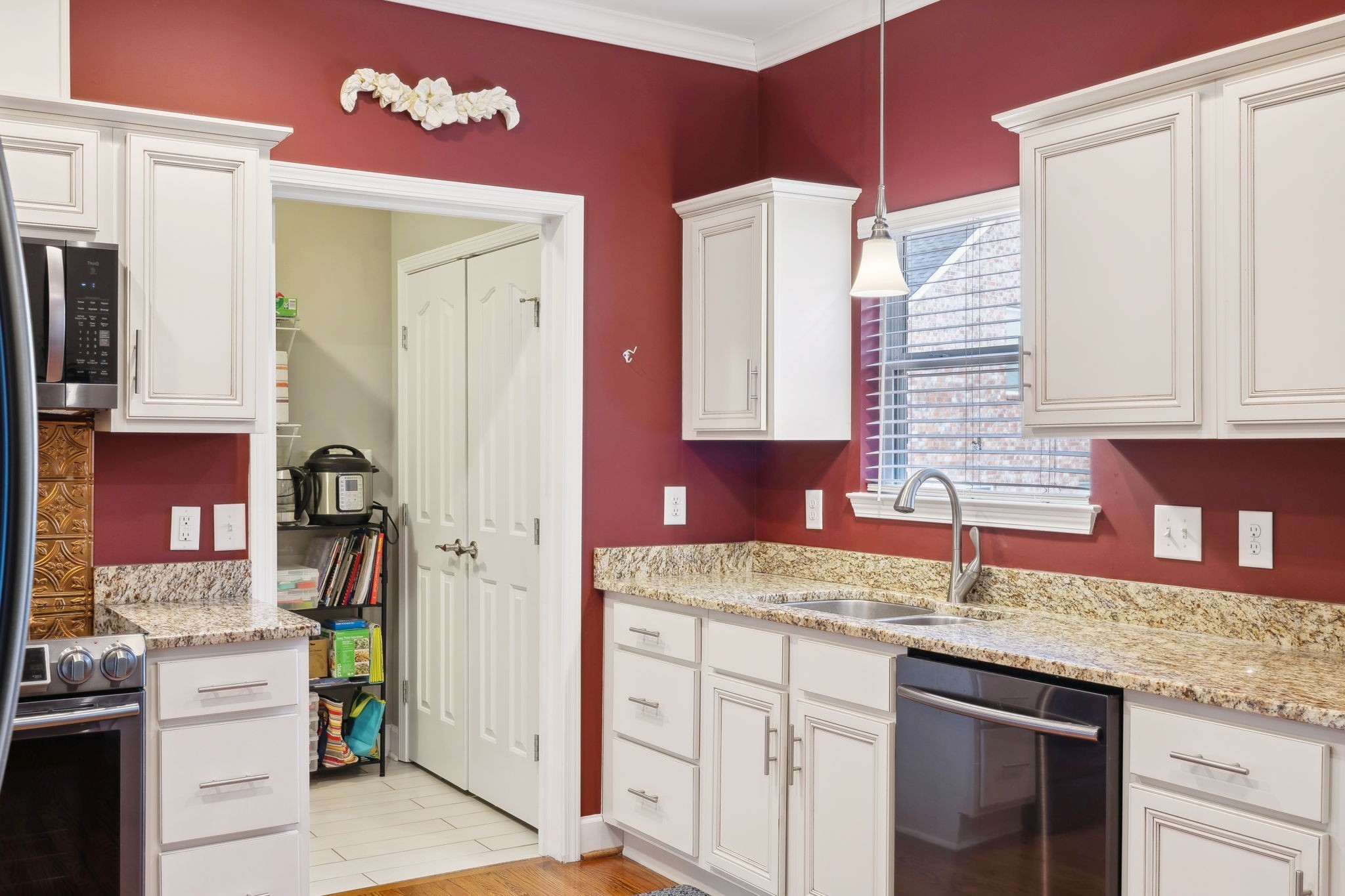 7126 Fernvale Springs Way Fairview, TN 37062 - Photo 13 of 35 a kitchen with stainless steel appliances granite countertop a sink and cabinets
