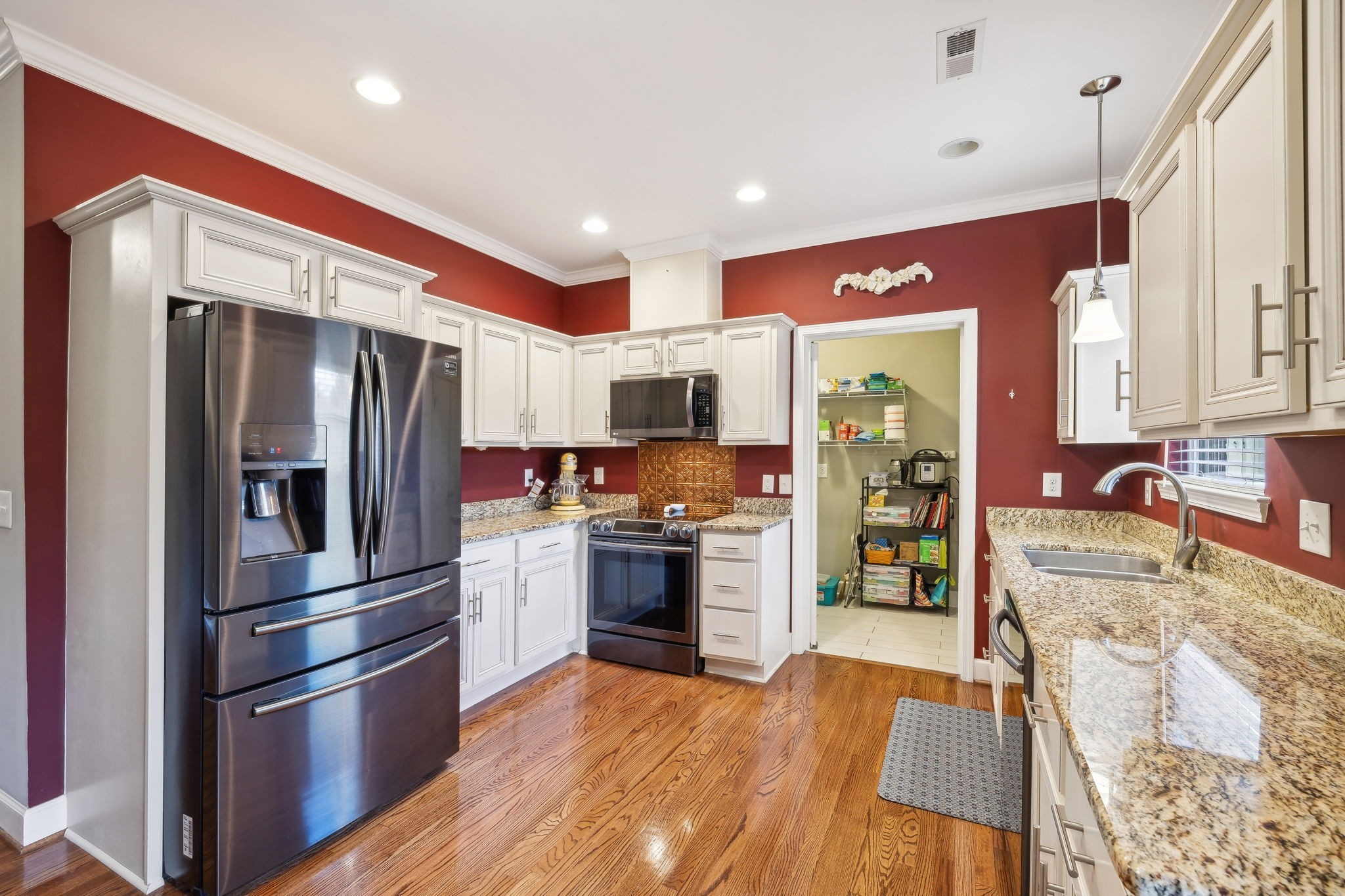 7126 Fernvale Springs Way Fairview, TN 37062 - Photo 16 of 35 a kitchen with stainless steel appliances granite countertop a refrigerator and a stove top oven