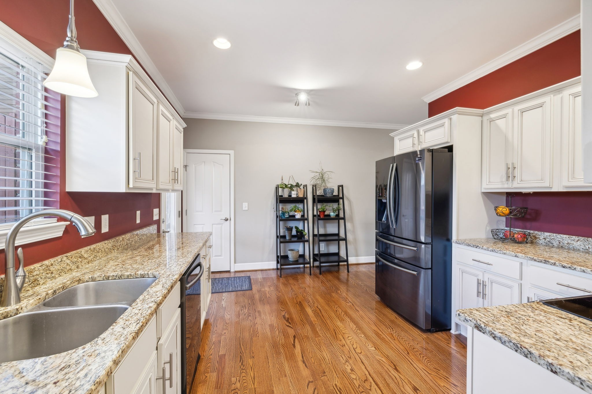 7126 Fernvale Springs Way Fairview, TN 37062 - Photo 17 of 35 a kitchen with stainless steel appliances granite countertop a refrigerator a sink a stove and a wooden floors