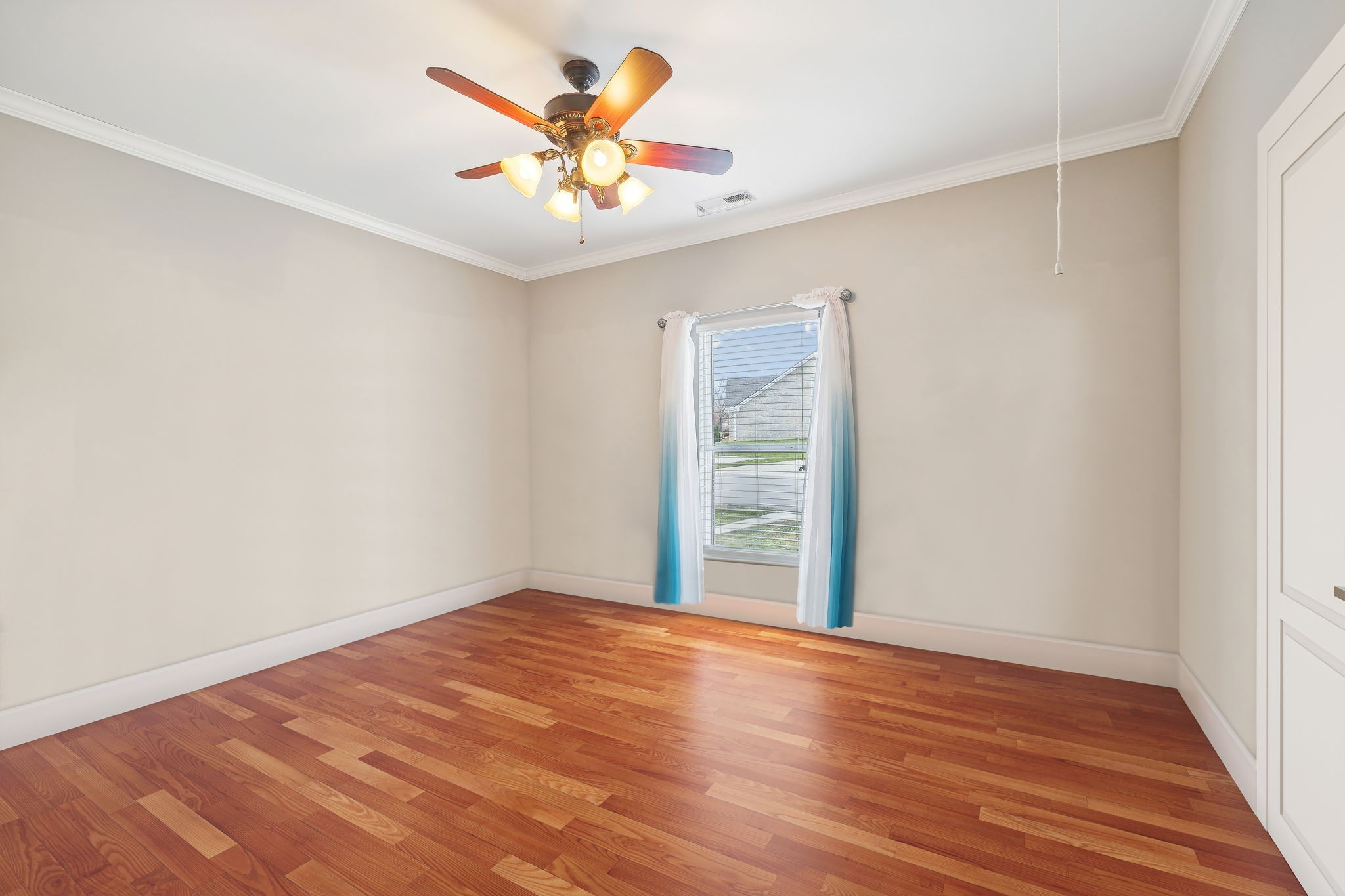 7126 Fernvale Springs Way Fairview, TN 37062 - Photo 25 of 35 an empty room with wooden floor and chandelier fan
