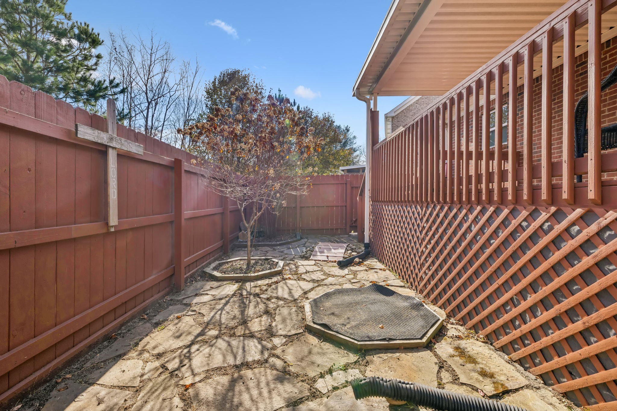7126 Fernvale Springs Way Fairview, TN 37062 - Photo 30 of 35 a backyard of a house with a chair and wooden fence