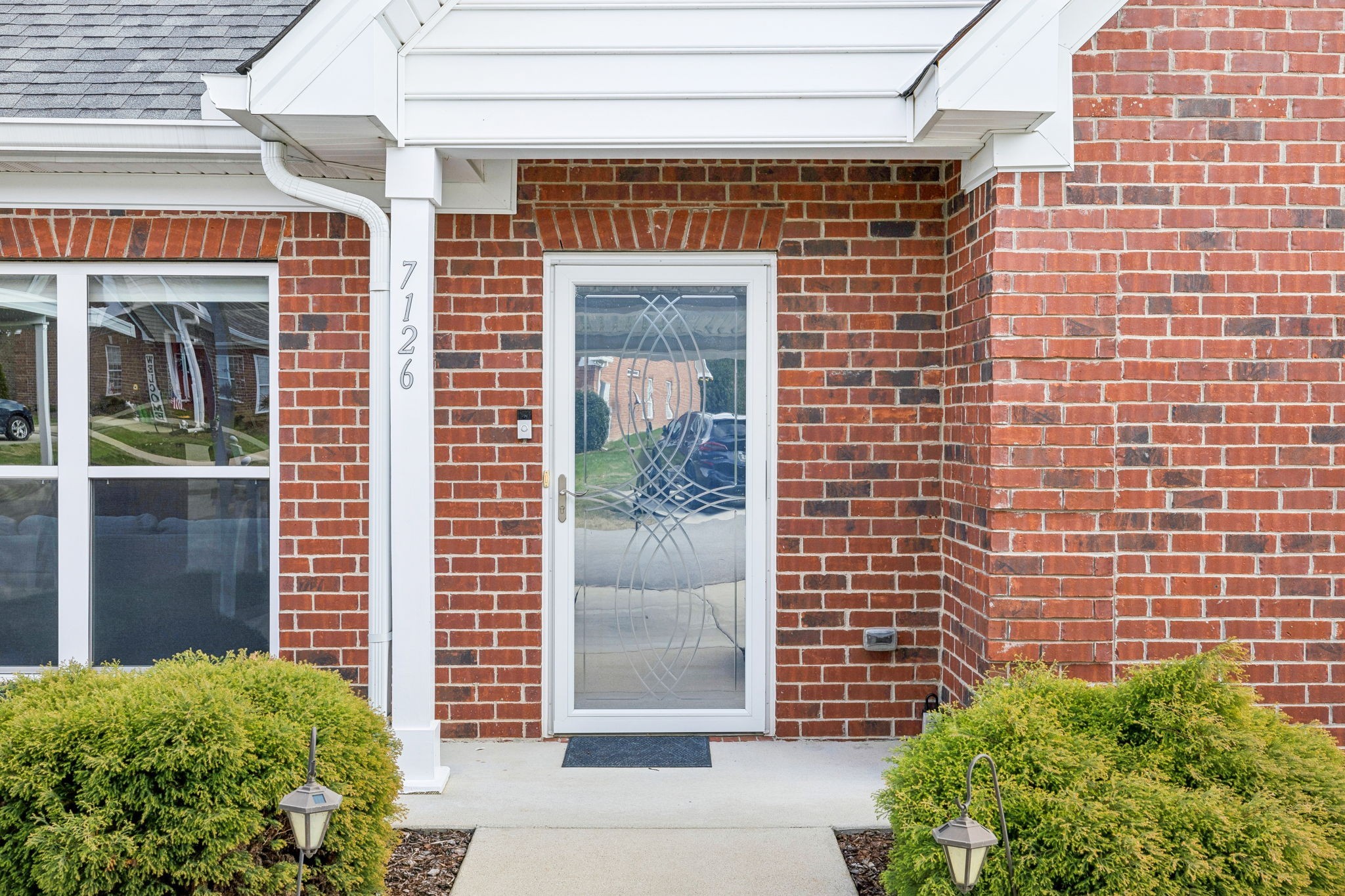 7126 Fernvale Springs Way Fairview, TN 37062 - Photo 4 of 35 a view of a brick building with a window and door