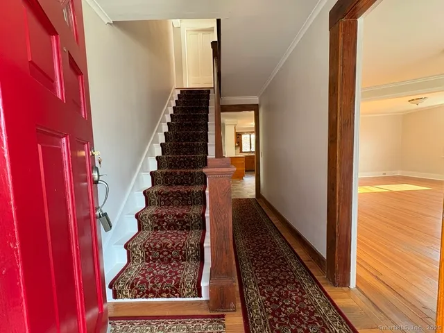 a view of entryway with wooden floor