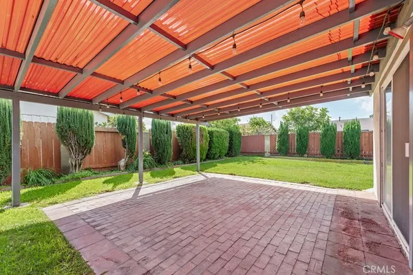a view of yard with patio