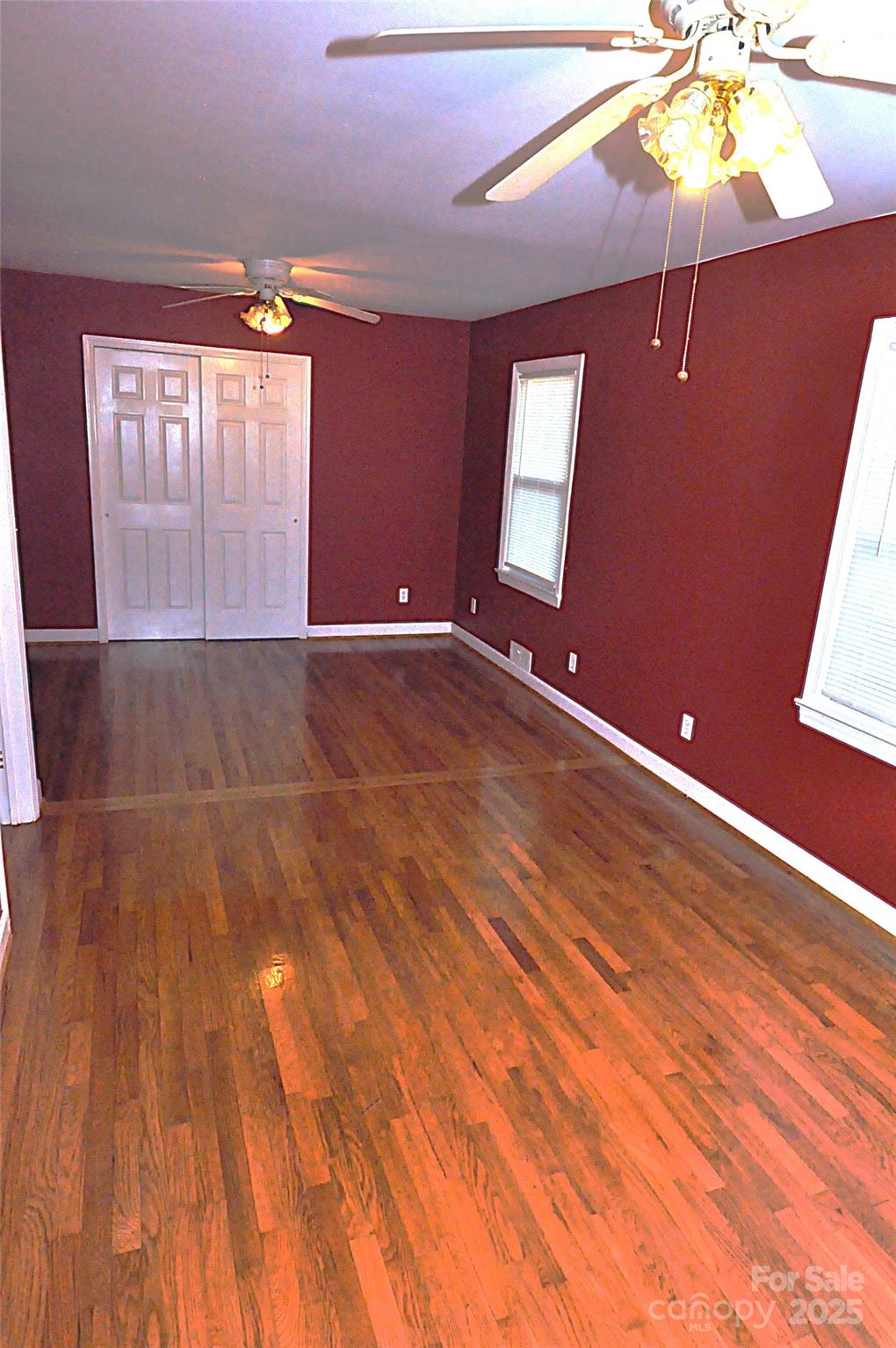 109 Hardin Street Chester, SC 29706 - Photo 17 of 25 a view of an empty room with window and wooden floor