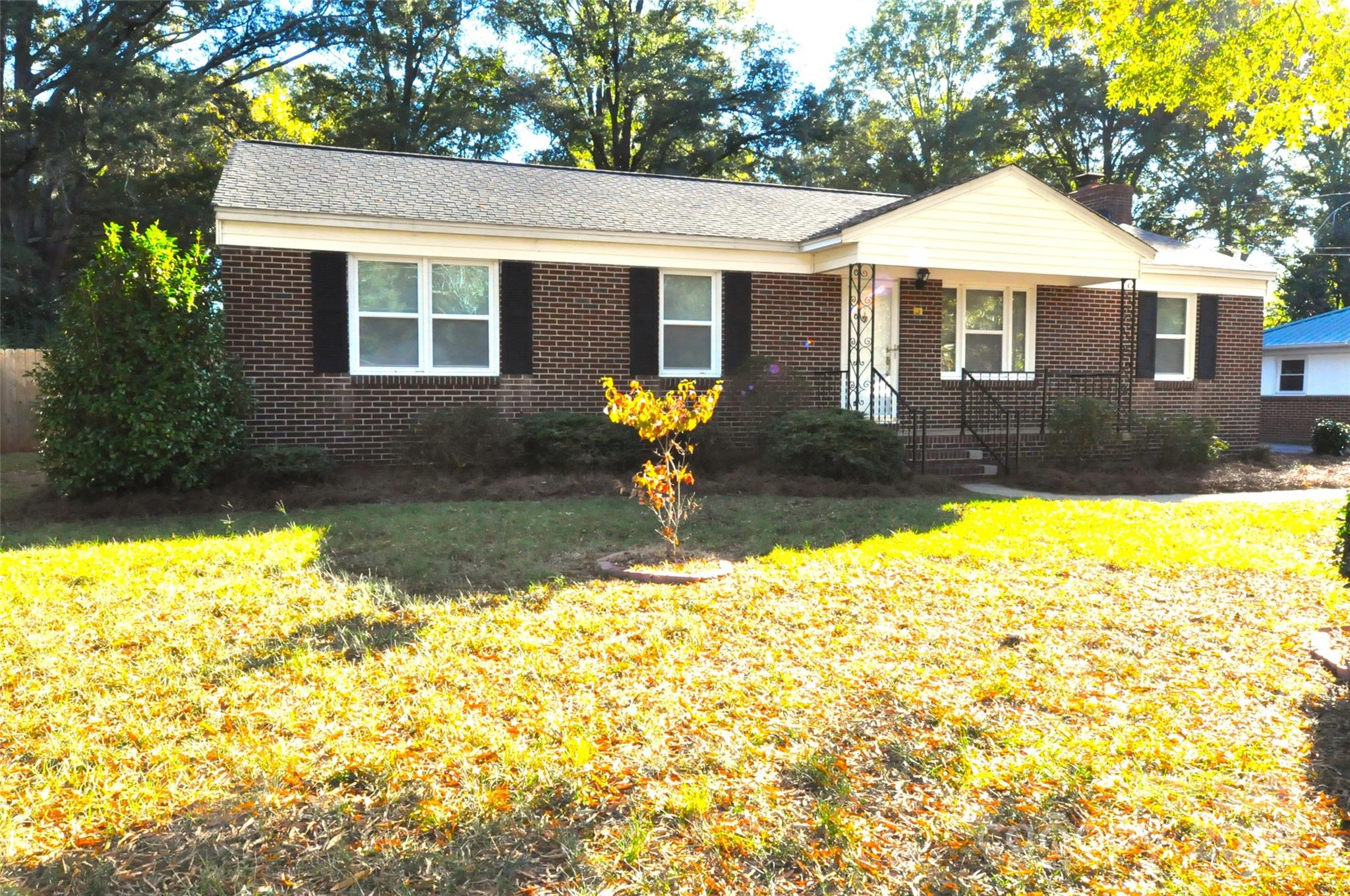 109 Hardin Street Chester, SC 29706 - Photo 2 of 25 a front view of a house with a garden and yard