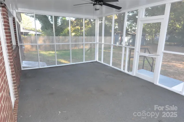 a view of an empty room with a sliding door