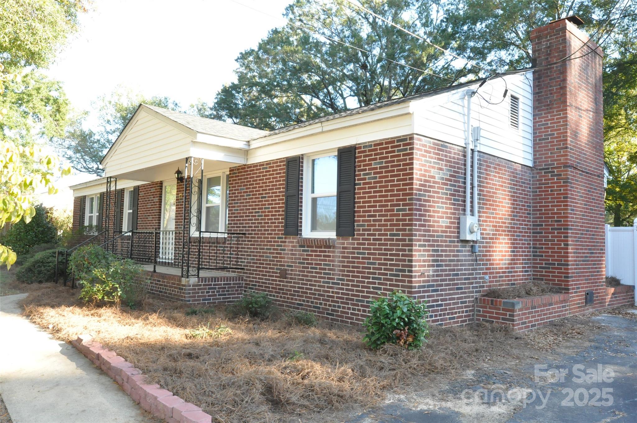 109 Hardin Street Chester, SC 29706 - Photo 3 of 25 a view of a house with a yard and large tree