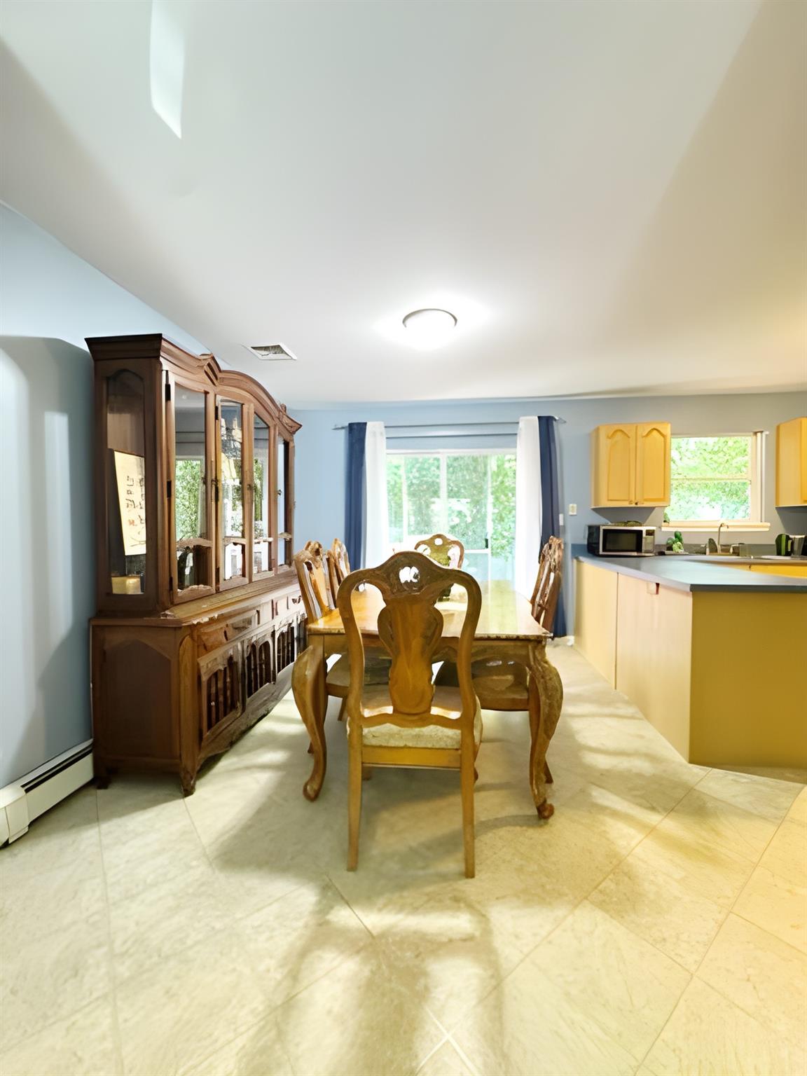 60 Aloma Road Rocky Point, NY 11778 - Photo 14 of 34 a living room with furniture and a kitchen