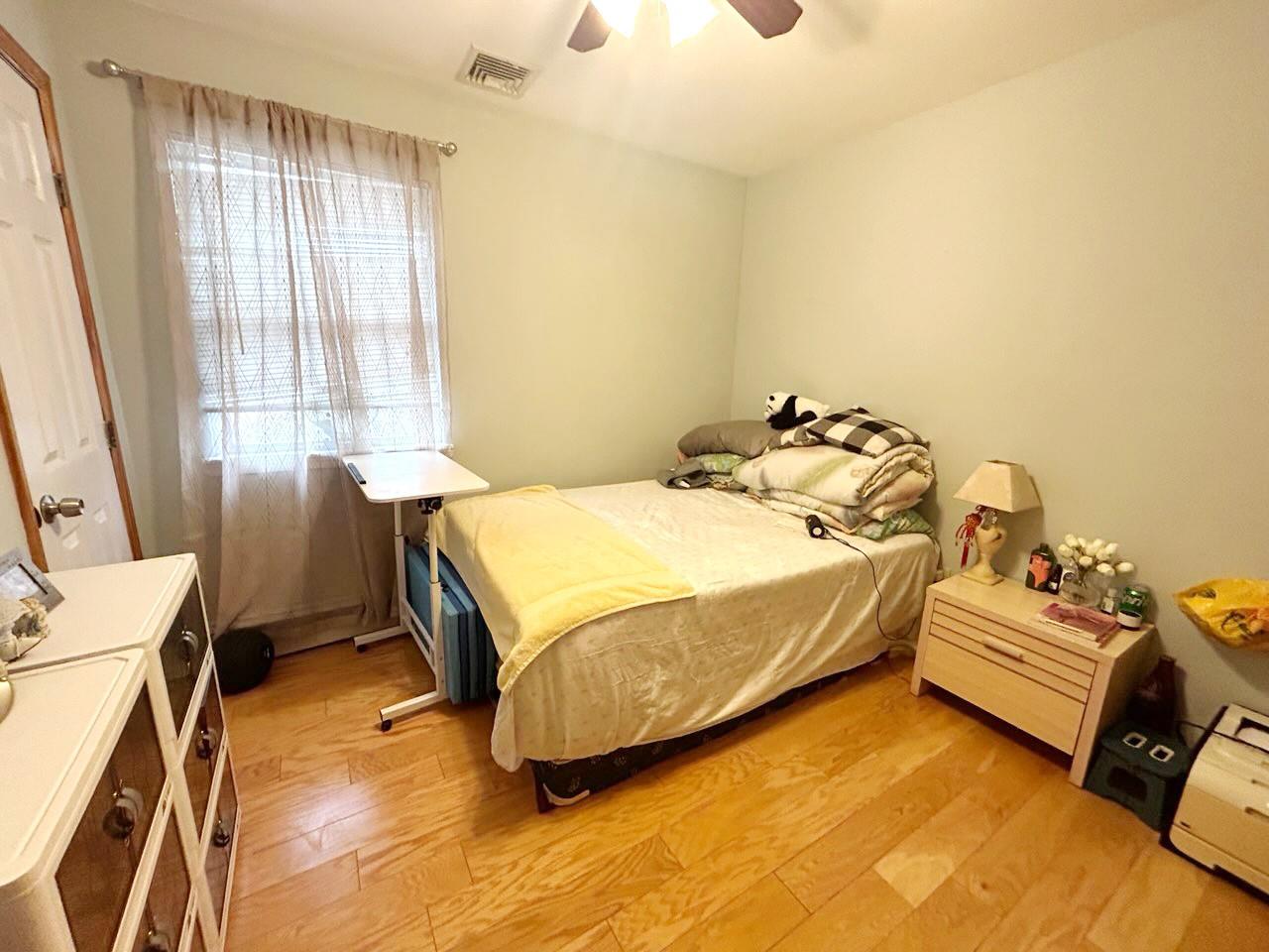 60 Aloma Road Rocky Point, NY 11778 - Photo 7 of 34 a spacious bedroom with a bed and a window