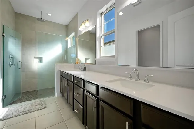 a bathroom with a sink and shower