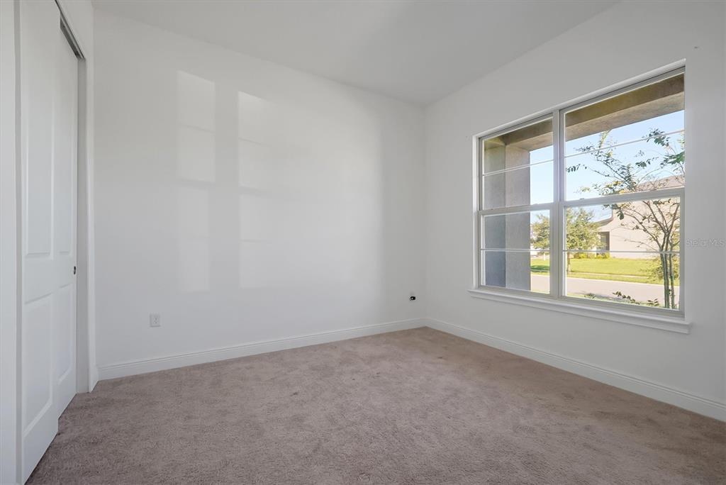 5200 Myrtleleaf Court St. Cloud, FL 34772 - Photo 22 of 59 an empty room with windows