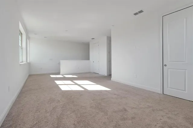a bathroom with a double vanity sink a mirror and a bathtub