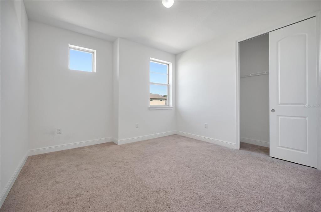 5200 Myrtleleaf Court St. Cloud, FL 34772 - Photo 28 of 59 an empty room with windows