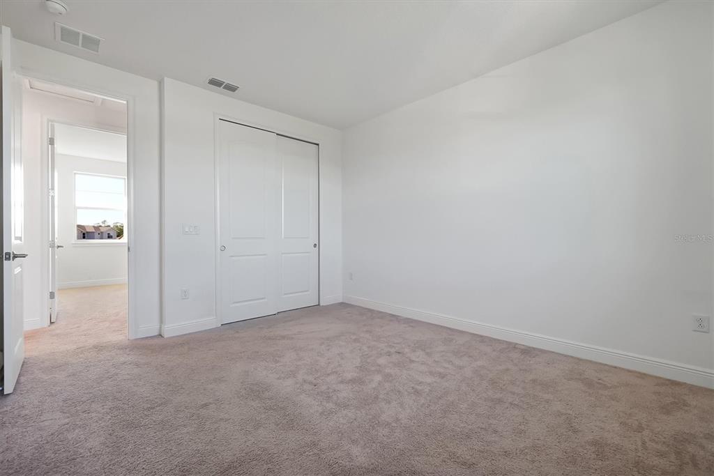 5200 Myrtleleaf Court St. Cloud, FL 34772 - Photo 35 of 59 an empty room with entrance door