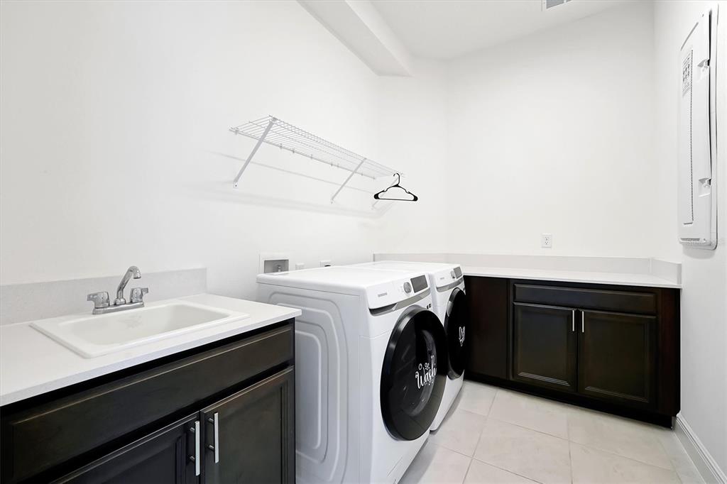 5200 Myrtleleaf Court St. Cloud, FL 34772 - Photo 36 of 59 a utility room with dryer and washer