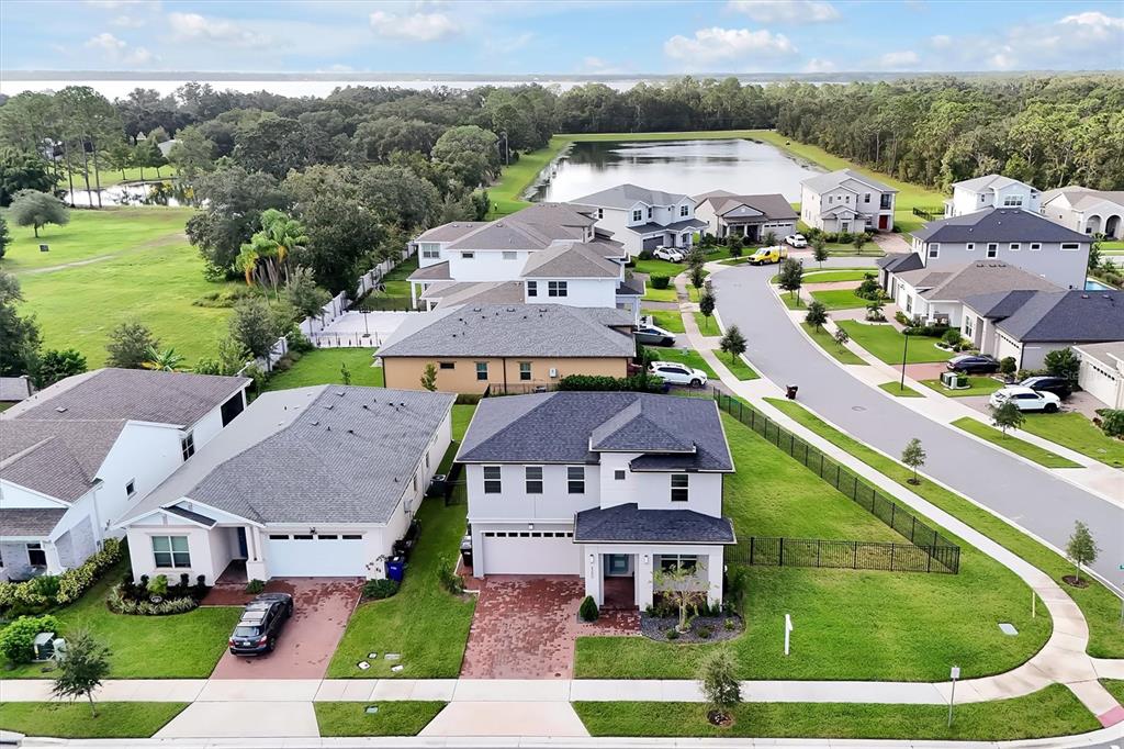 5200 Myrtleleaf Court St. Cloud, FL 34772 - Photo 43 of 59 an aerial view of houses with yard