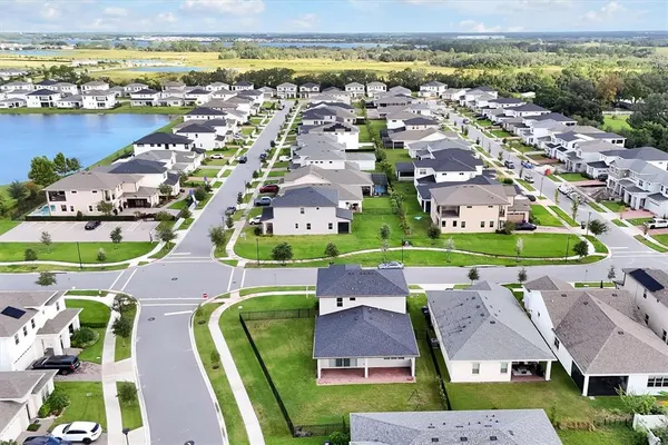 a view of a house with swimming pool and sitting area