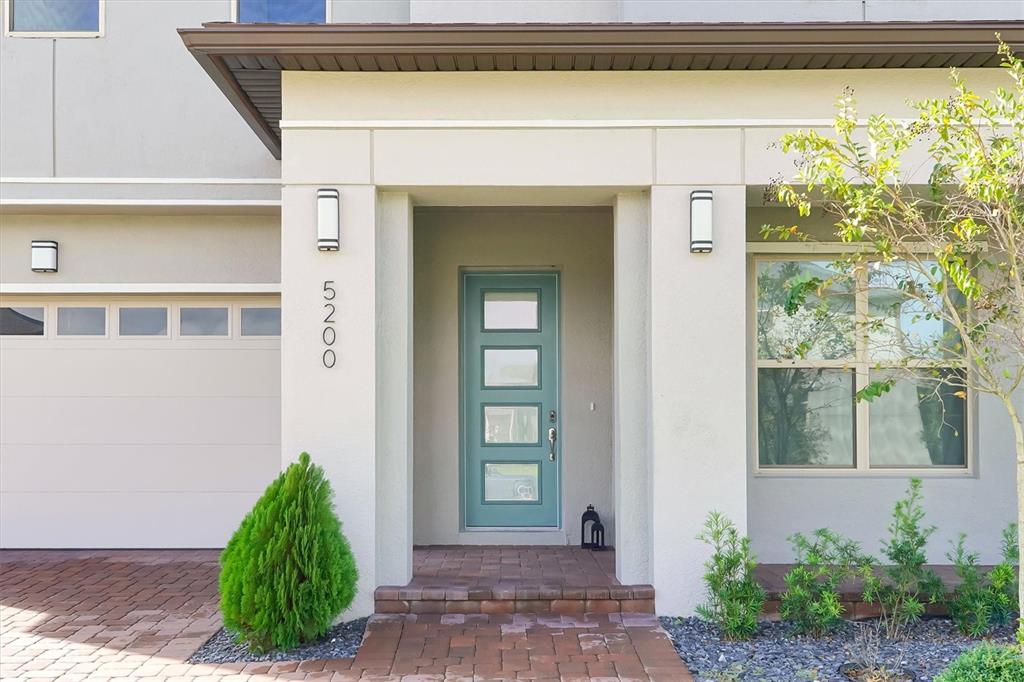 5200 Myrtleleaf Court St. Cloud, FL 34772 - Photo 5 of 59 a front view of a house with garden