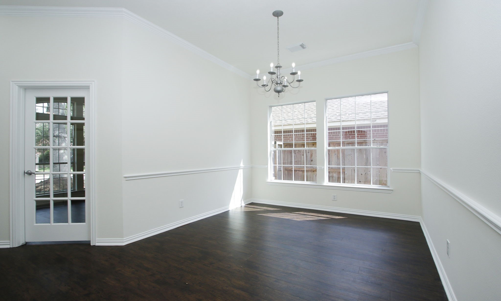 1210 Berwick Manor Court Spring, TX 77379 - Photo 15 of 50 an empty room with wooden floor and windows