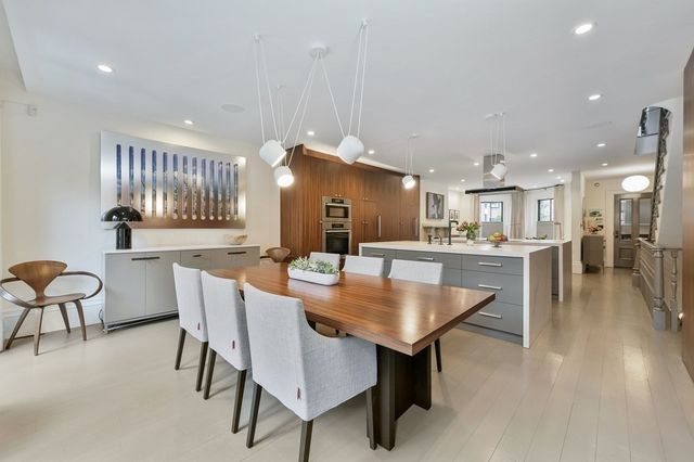 a dining room with furniture and wooden floor