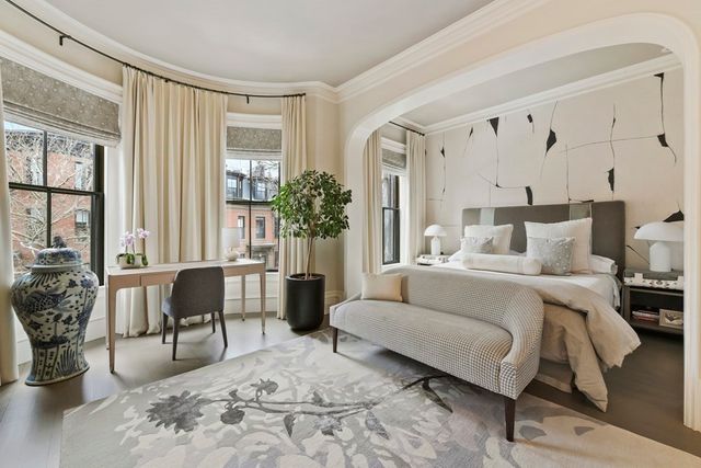 a bedroom with furniture and windows