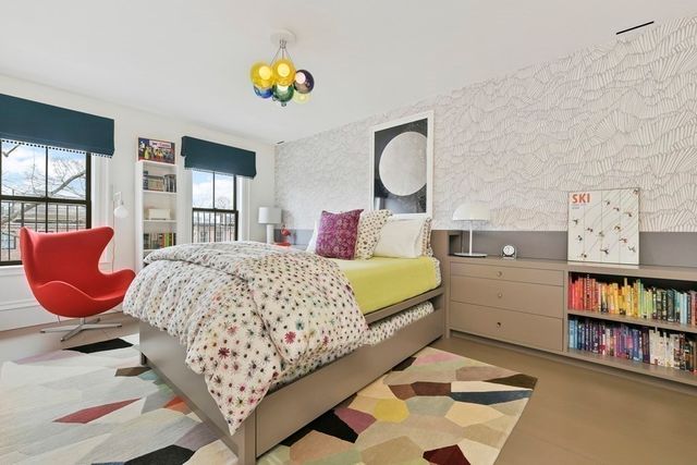 a bedroom with a bed and dresser