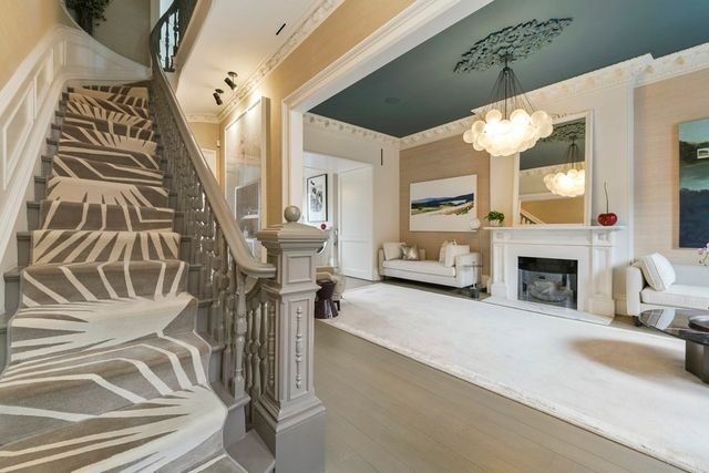 a view of a livingroom with furniture and a fireplace