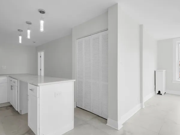 a view of a hallway with closet