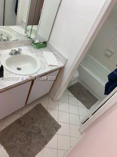 Crystal Lake Deerfield Beach, FL 33064 - Photo 12 of 13 a bathroom with a sink and a mirror