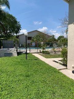 Crystal Lake Deerfield Beach, FL 33064 - Photo 5 of 13 a view of a garden with sitting area