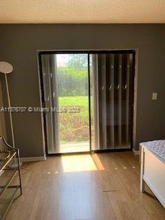 Crystal Lake Deerfield Beach, FL 33064 - Photo 9 of 13 a view of a black and white wall with wooden floor