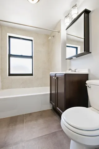 a bathroom with a toilet a sink and a bathtub