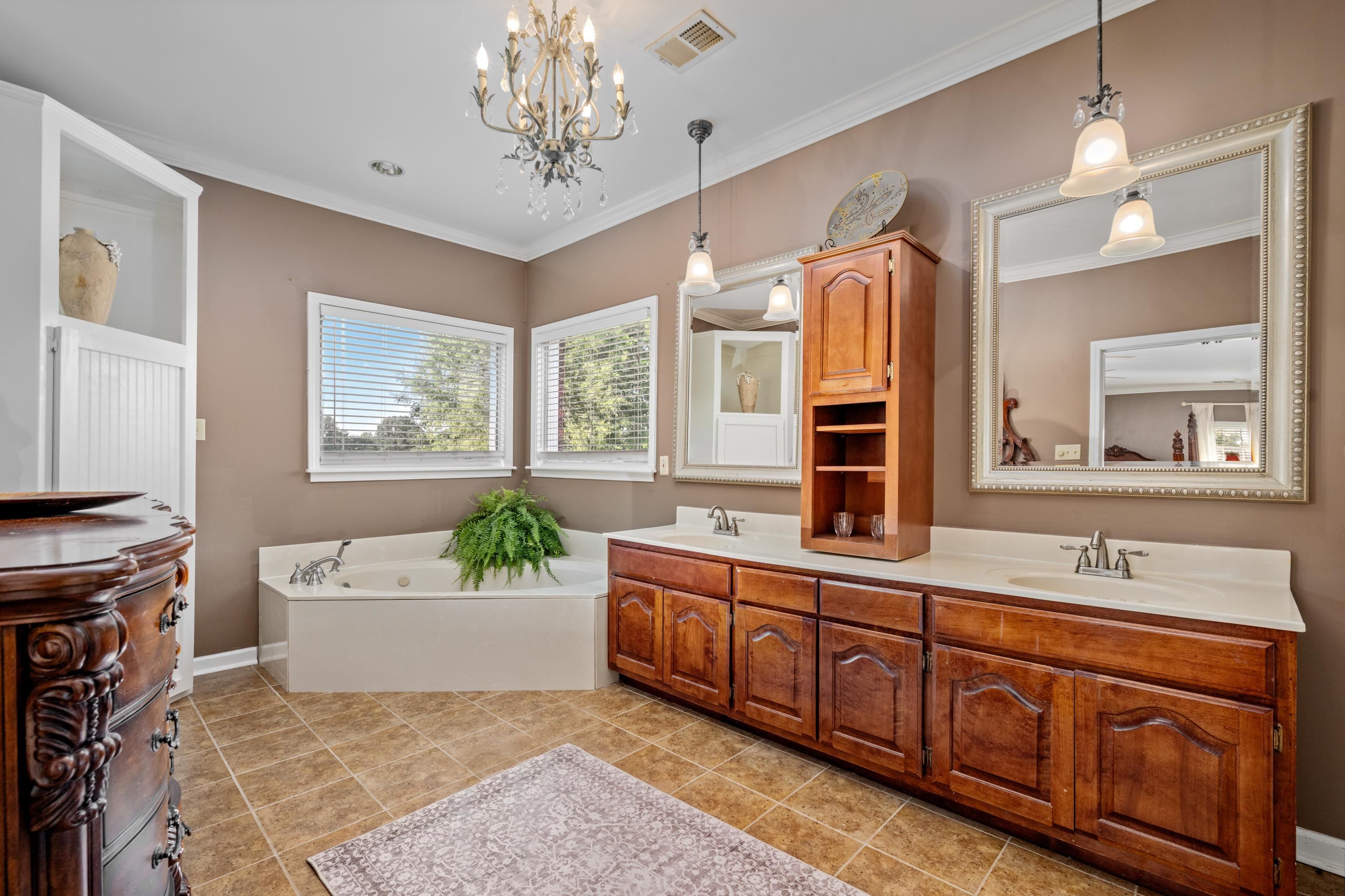 1354 Wilburn Road Michigan City, MS 38647 - Photo 14 of 40 a bathroom with a sink double vanity granite tub and a mirror