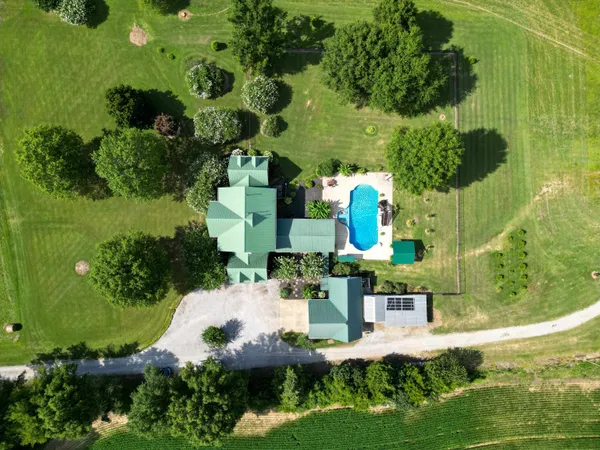 a view of a house with swimming pool yard and sitting area