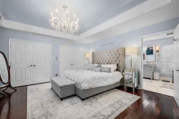a bathroom with a toilet a sink and a mirror