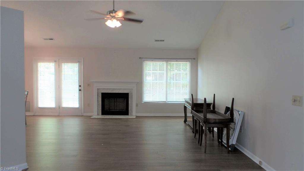 3312 Timberwolf Avenue High Point, NC 27265 - Photo 3 of 29 Large Great Room with Vaulted ceilings and ceiling fan! NEW Bamboo Engineered Hardwoods throughout Great Room, Dining Room, Foyer, 3rd Bedroom and hallway.