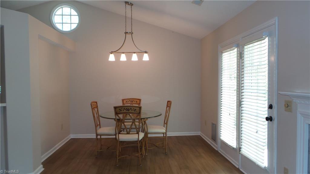 3312 Timberwolf Avenue High Point, NC 27265 - Photo 7 of 29 Dining Room with Picture window below vaulted ceiling.