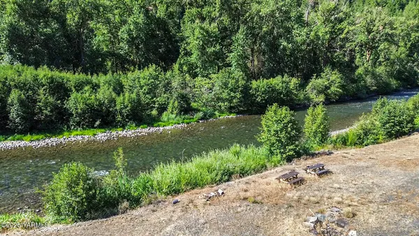 a view of a garden with a lake