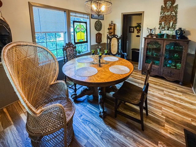 38569 North Sheridan Road, Unit 390 Beach Park, IL 60099 - Photo 6 of 28 a view of a dining room with furniture and wooden floor