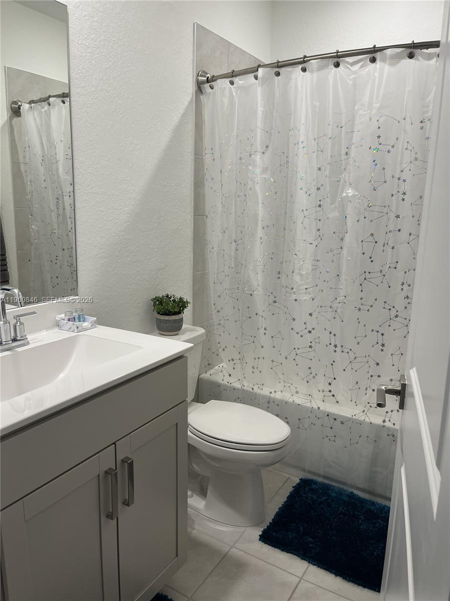 784 Southeast 19th Street, Unit 784 Homestead, FL 33034 - Photo 12 of 22 a bathroom with a sink a toilet and shower