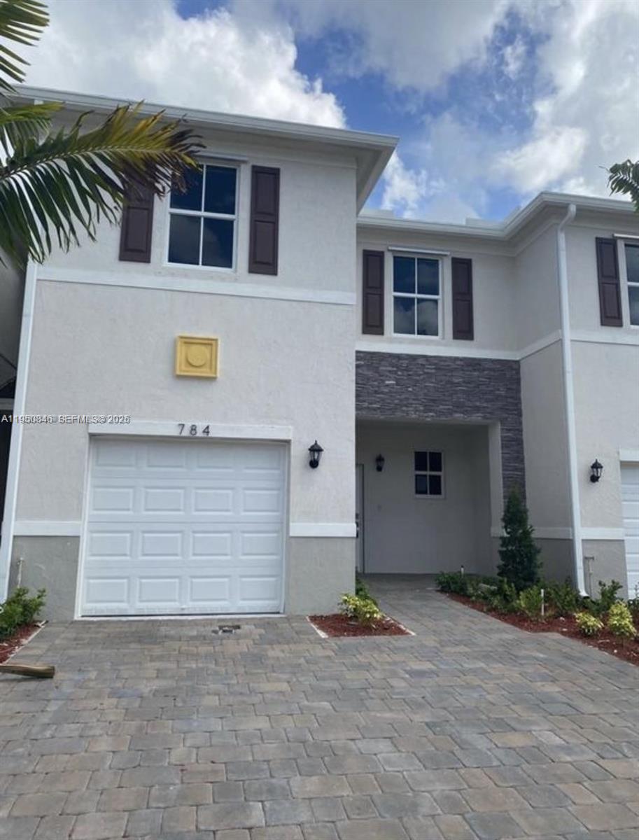 784 Southeast 19th Street, Unit 784 Homestead, FL 33034 - Photo 14 of 22 a front view of house with yard