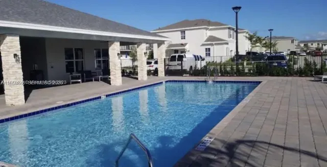 a view of a living room and kitchen