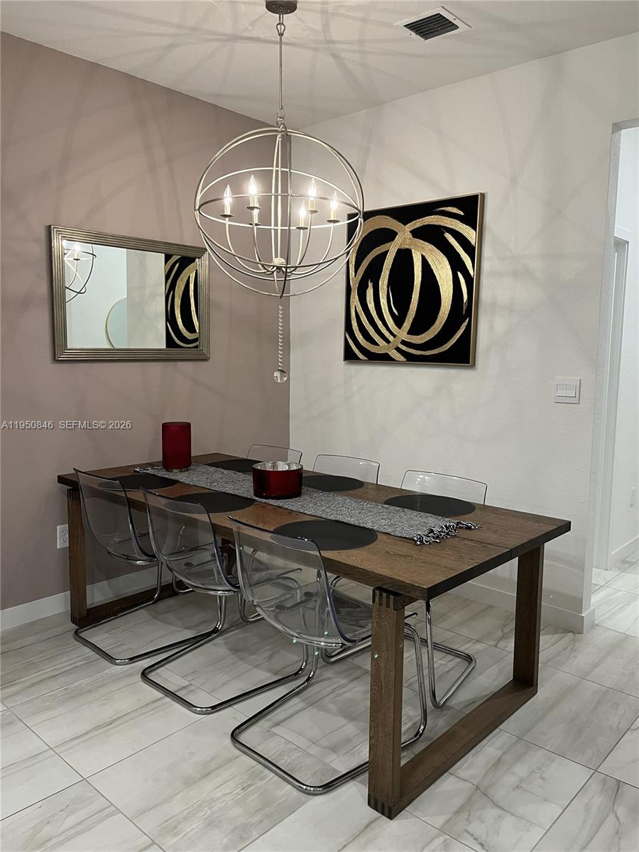 784 Southeast 19th Street, Unit 784 Homestead, FL 33034 - Photo 3 of 22 a view of a room with chairs