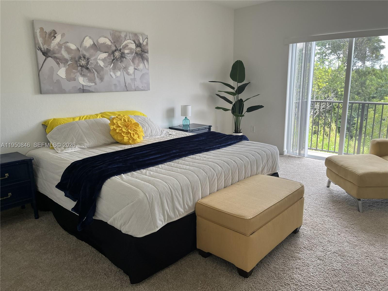 784 Southeast 19th Street, Unit 784 Homestead, FL 33034 - Photo 7 of 22 a bedroom with a bed a couch and a window