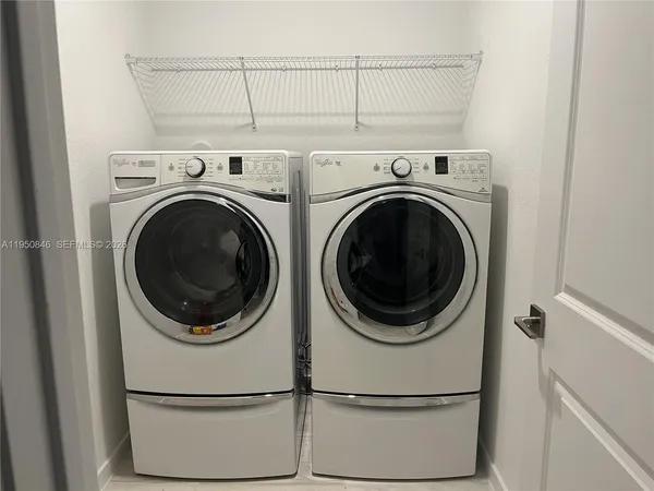 a utility room with dryer and washer