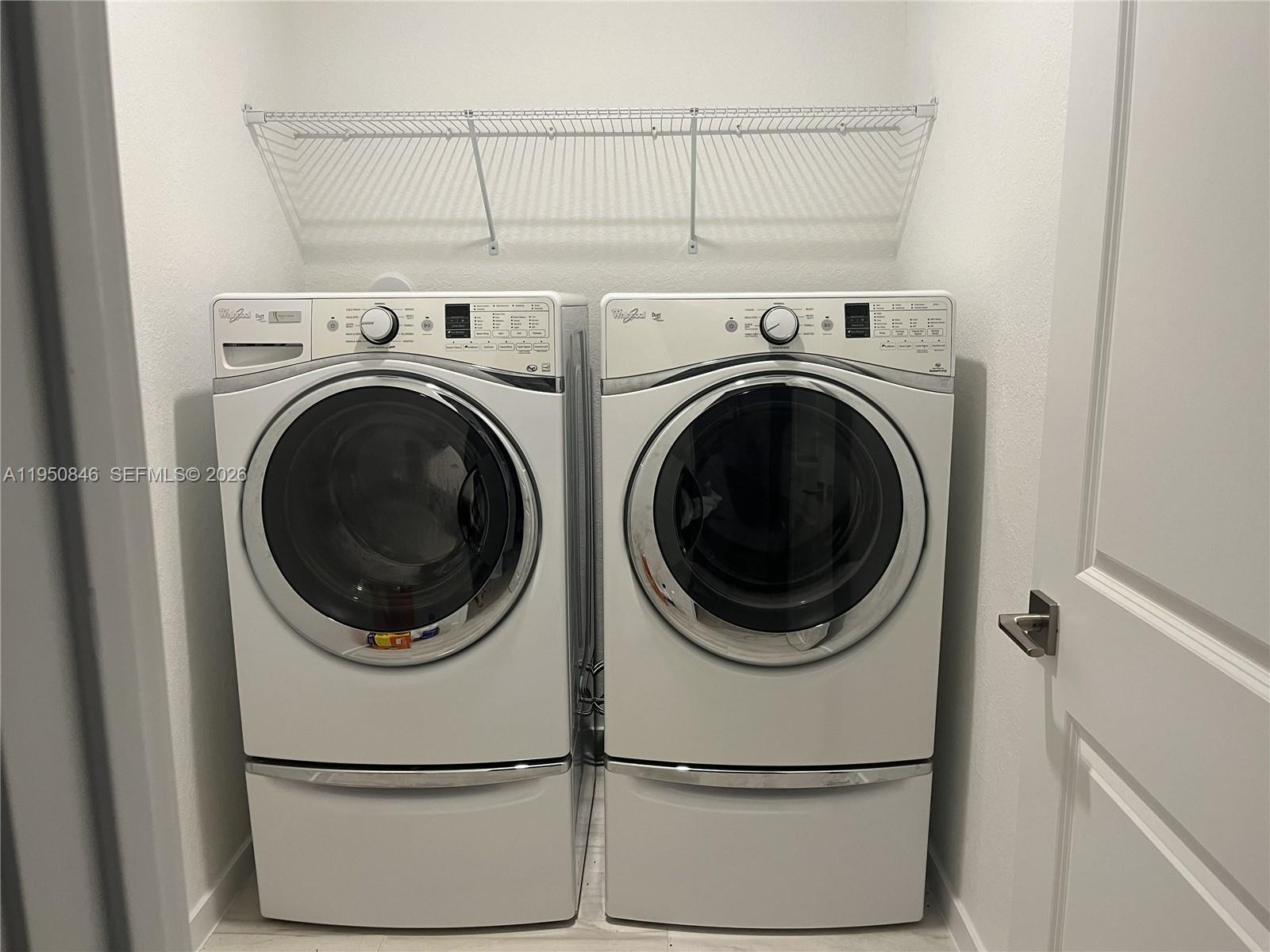 784 Southeast 19th Street, Unit 784 Homestead, FL 33034 - Photo 9 of 22 a utility room with dryer and washer