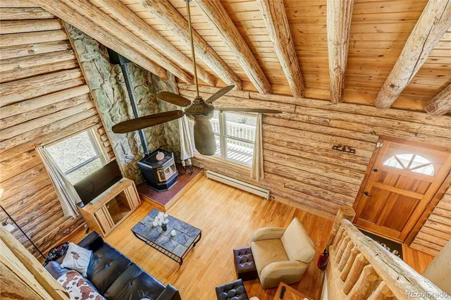 a view of a living room with furniture and a rug