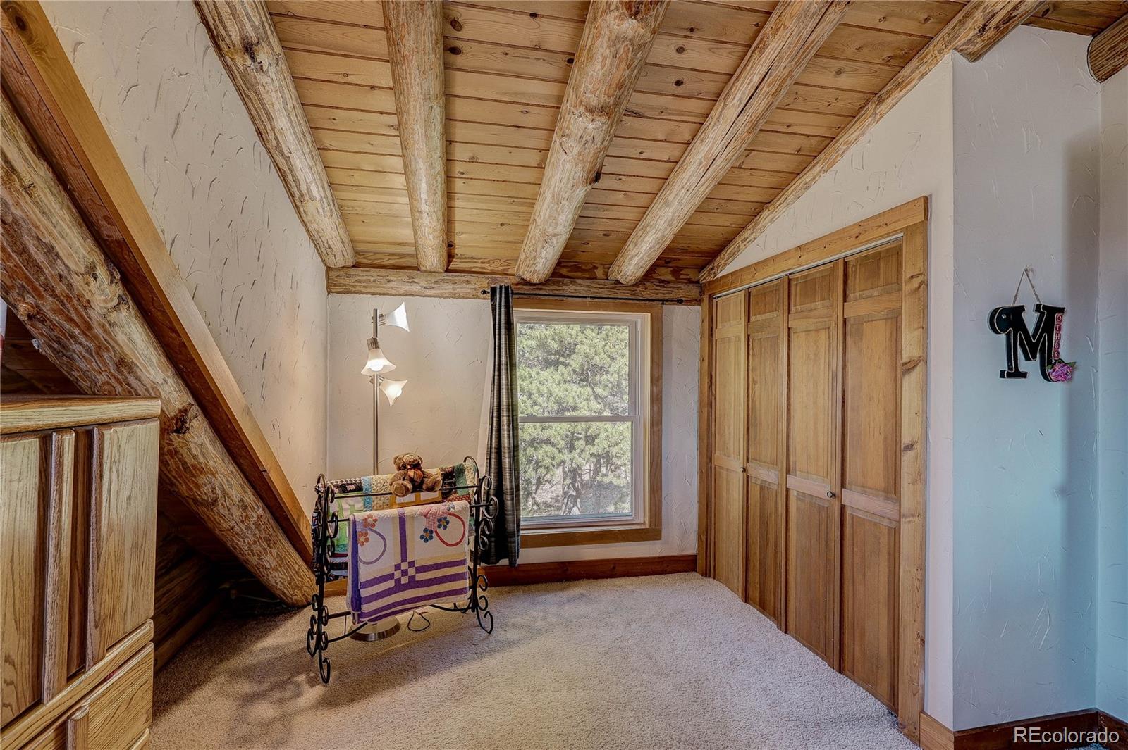 11142 Conifer Mountain Road Conifer, CO 80433 - Photo 42 of 50 a view of an entryway with staircase