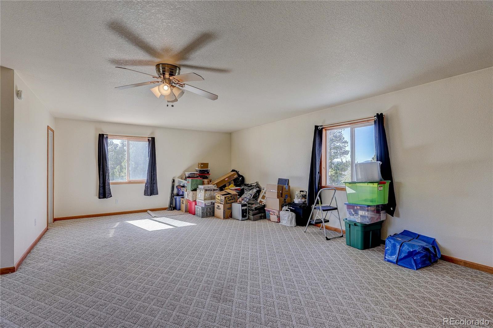 11142 Conifer Mountain Road Conifer, CO 80433 - Photo 45 of 50 a view of a livingroom with toys